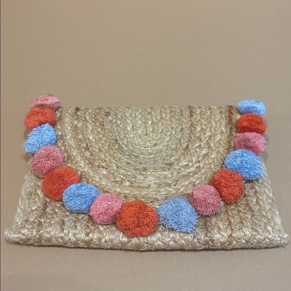 Straw Clutch with Colorful Pom Poms and gold accents